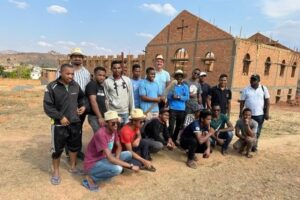 The young Salvatorian seminarians of Madagascar in front of the new formation house that is under construction in Antenarivo. hey will later join the proposed international novitiate house in Uganda.